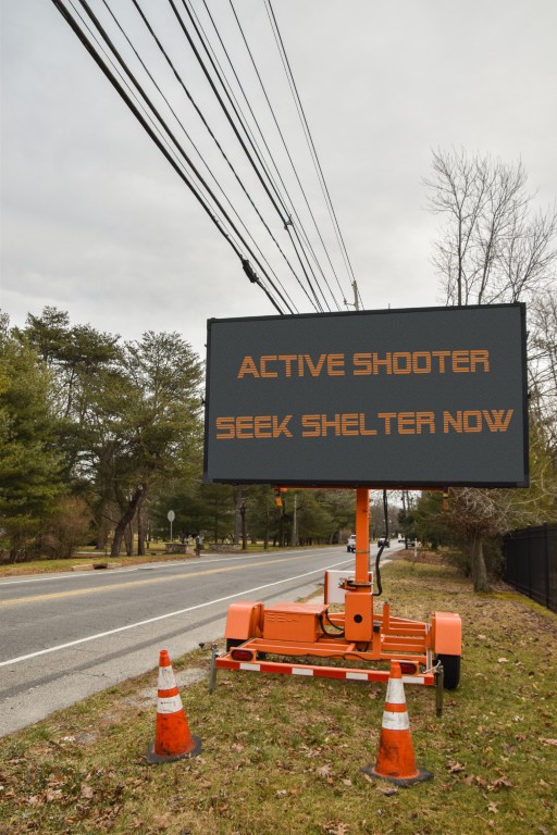 Electronic,Sign,Near,A,Road,That,Says,,Active,Shooter,Take Active Shooter sign on roadside in Rhode Island