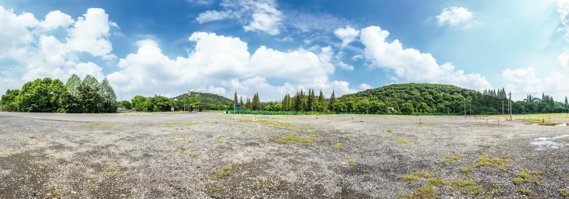 Park,Sand,Road,Large,Parking,Lot,And,Green,Mountain,Nature